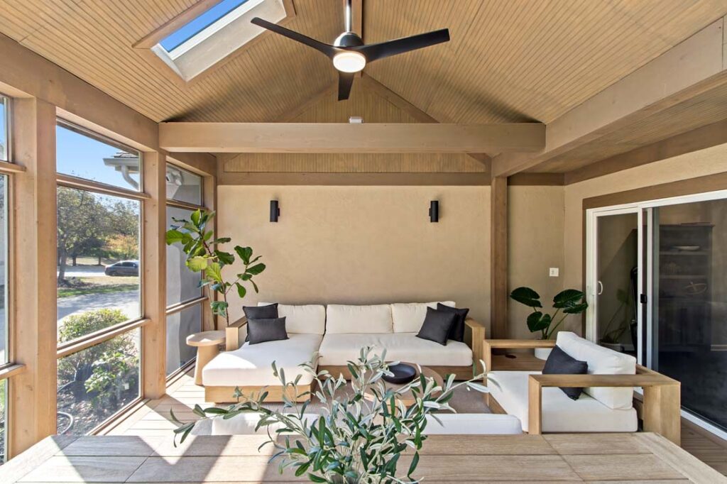 seating area in screened porch addition